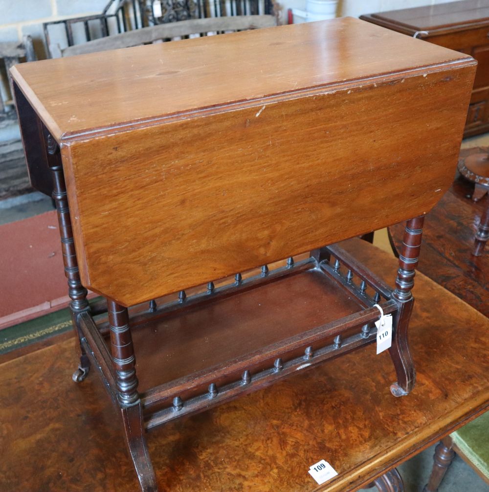 A Victorian Aesthetic period mahogany occasional table, with canted flaps and galleried understage, width 61cm